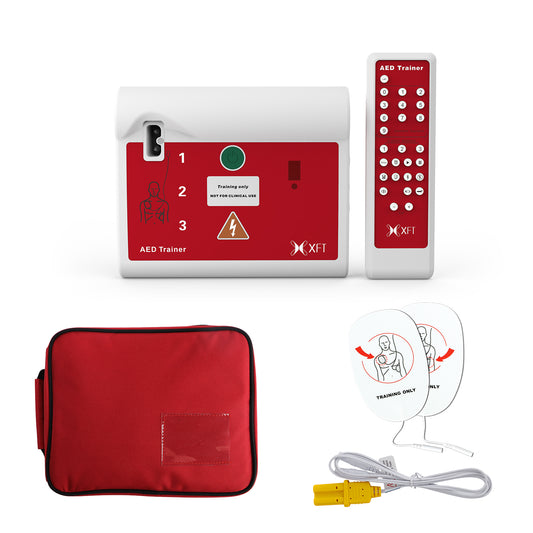 The complete XFT-120C portable AED trainer set, including the device, red pouch, remote, and pads